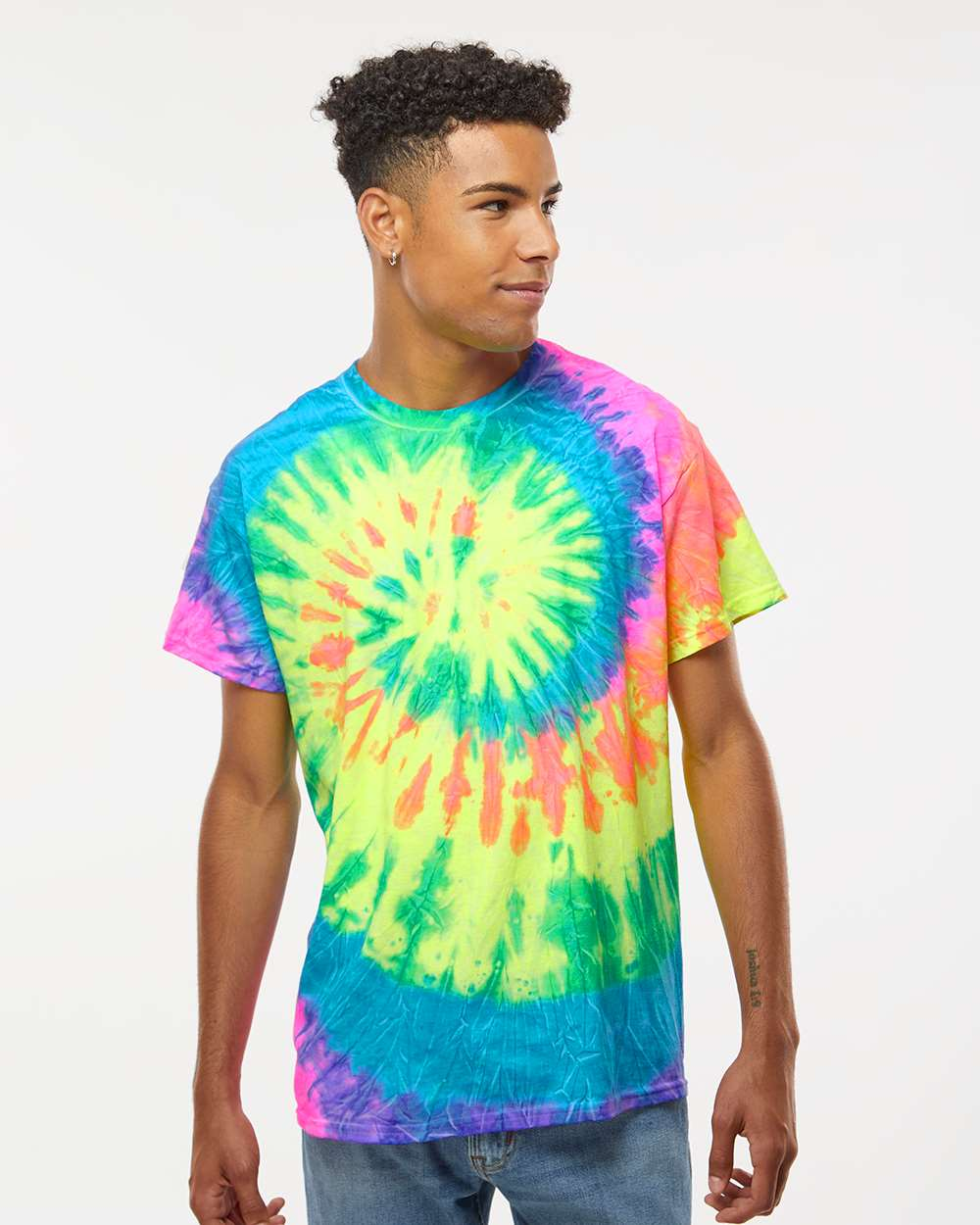 Man wearing a colorful tie-dye T-shirt with a spiral pattern.